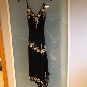 Never worn but no tags. Embroidered and beaded appliqué.